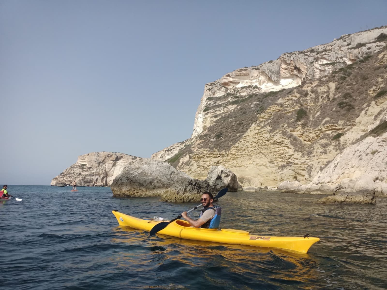 Amogh kayaking off the coast of Cagliari, Italy